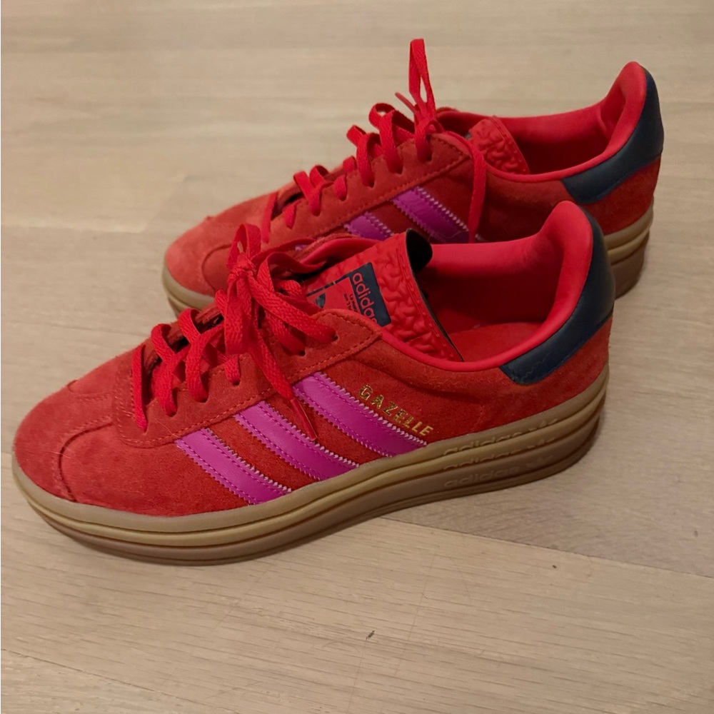 Adidas red suede sneakers with pink stripes